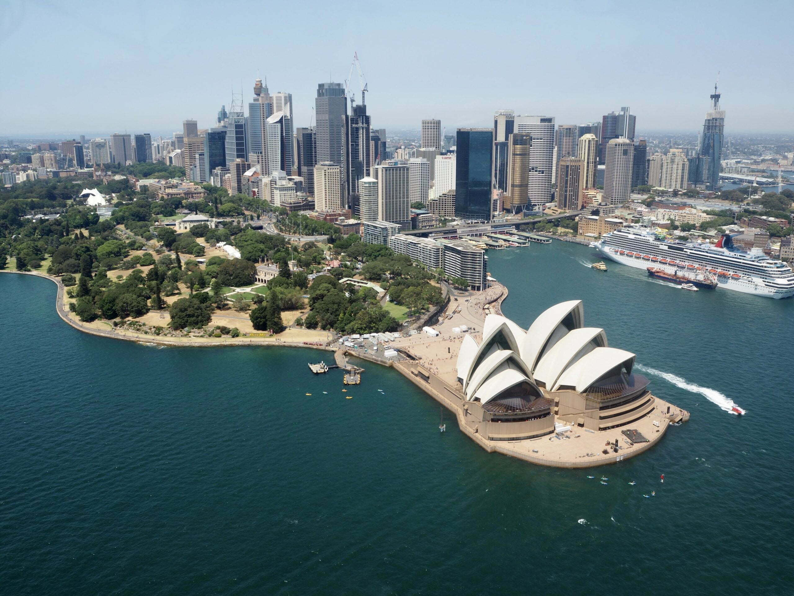 Aerial view of Sydney Opera House and cityscape, iconic Australian theatre venue