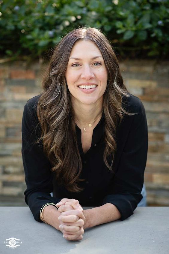 Julia Bryant, Senior Editor for Celebrity Exchange, portrait of a smiling woman.