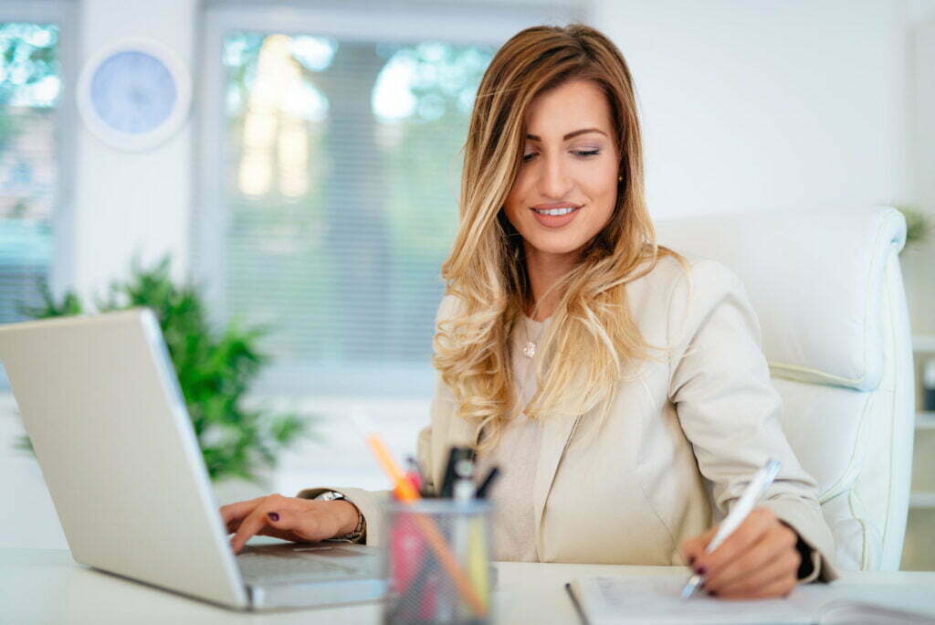 Woman working on laptop illustrating lifestyle and career articles